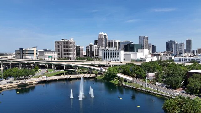 Still shot overlooking Lake Lucerne fountain and the downtown Orlando skyline in Orange County, Orlando, Florida, USA.
