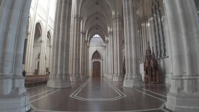 Side aisle with neogothic columns and mystical lighting inside the Cathedral of La Plata City, Buenos Aires, Argentina D-Log M.