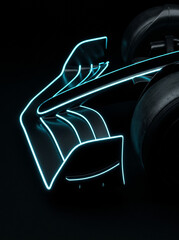 Naklejka premium vertical close up shot of formula 1 racing car front wing element featuring neon blue glowing aerodynamic lines on dark background modern high tech digital art