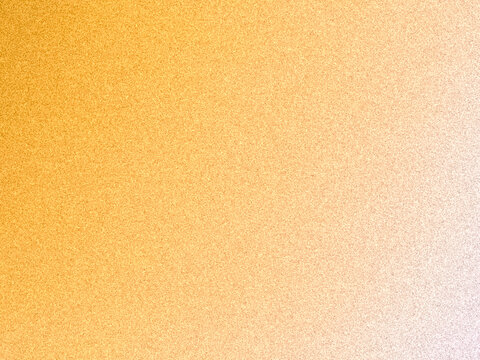 Abstract background texture with fine noisy grain and a soft gradient transition from vibrant yellow to warm orange and white. 