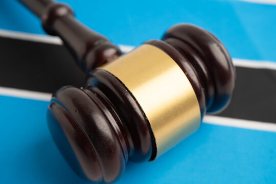 Botswana law, Legal, justice and agreement, wooden court gavel on flag.