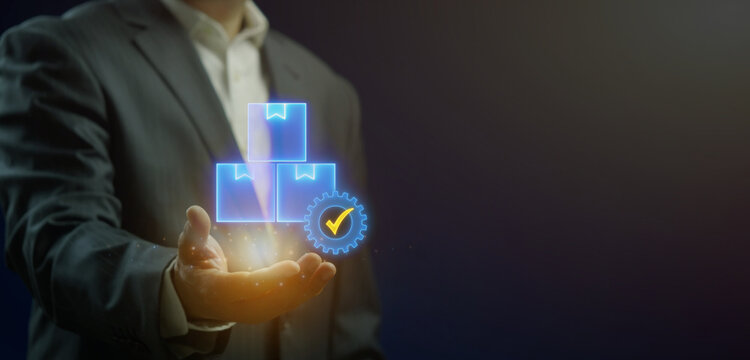 Businessman open hand supporting glowing parcel delivery boxes with verified checkmark. Order fulfillment quality assurance, logistics shipping safety, and cargo distribution package concept.