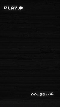 Old damaged vhs play with noise and static distortion vertical 4k video with static noise and grain. On black background 