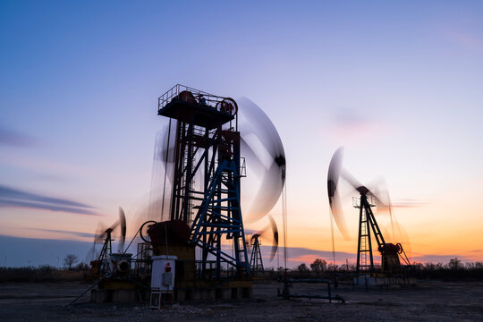 The silhouette of oilfield derrick