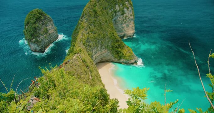 Iconic Kelingking beach with turquoise ocean waves seen from above in Nusa Penida Bali Indonesia