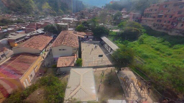 Medellin metrocable traveling over a residential neighborhood in colombia