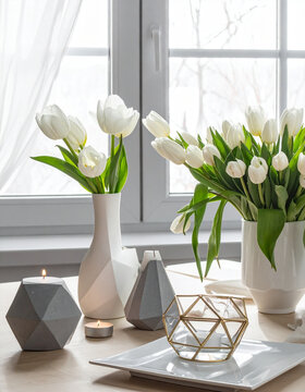 White tulips and decorative candles