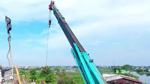 telescopic crane moving with blue sky background