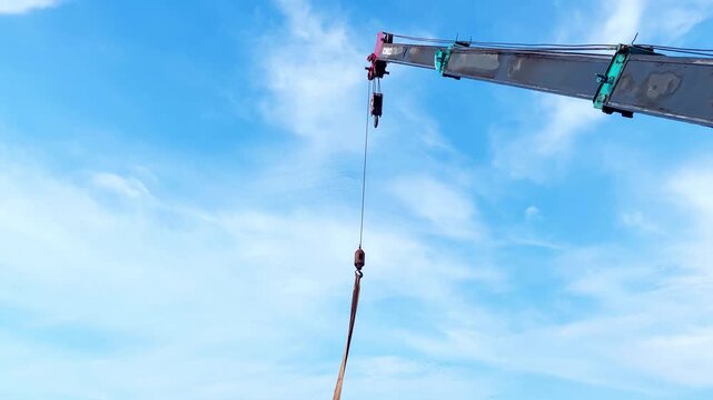 telescopic crane moving with blue sky background