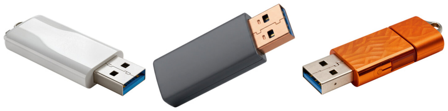Three USB flash drives in different colors: white, gray, and orange, isolated on a white background.