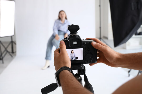 Professional photography session, commercial portrait production and creative studio work with a model on a white background for advertising campaigns