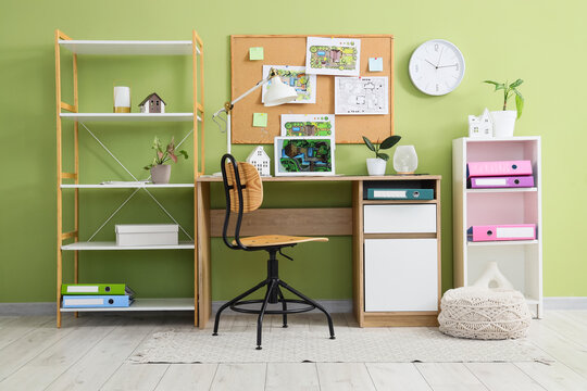 Remote work and home office setup, interior design workspace with laptop and architectural plans for freelance professional or student in modern room