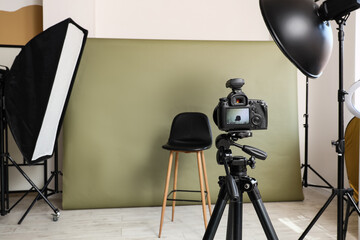 Naklejka premium Photography production and creative studio setup, professional camera on tripod with lighting equipment for commercial product or portrait photo shoot