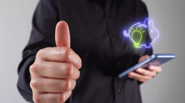 Smart saving. A woman holding a mobile phone and giving a thumbs-up, with a virtual icon of a piggy bank featuring a light bulb.