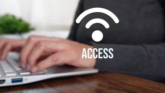 Close-up of hands typing and tapping wireless icon on laptop