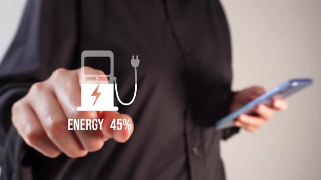 A businesswoman holding a smartphone while pointing toward an animation of an energy icon above a stylized electric pump, displaying a fill level and a percentage.