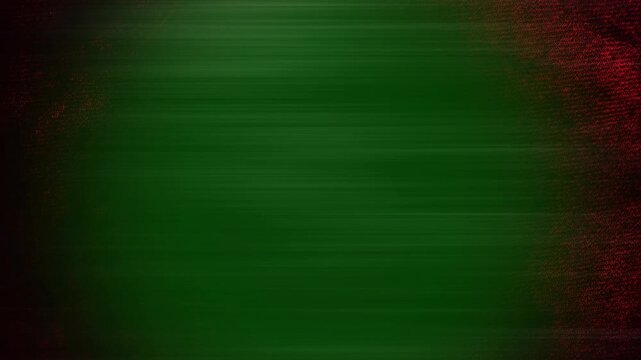 Distressed grunge texture background featuring dark green and red color gradient with motion blur effects with subtle debris particles