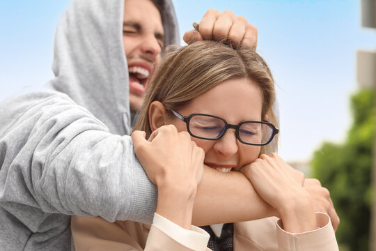 Domestic violence and physical abuse, aggressive man attacking woman in a dangerous confrontation and conflict situation
