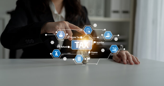 A professional woman interacts with glowing tax icons representing various finance concepts. The scene emphasizes modern tax strategies, incentives, and refunds in a digital workspace. Tessel