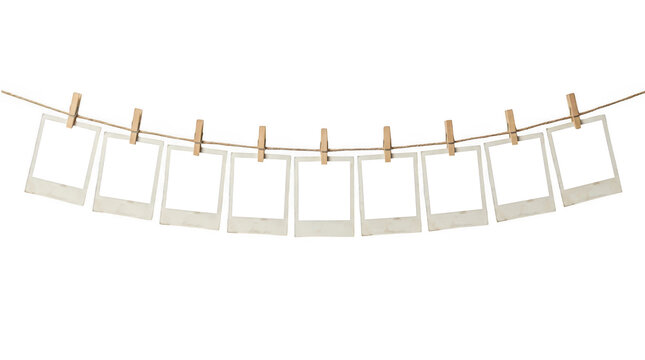 Blank photo frames hanging on a string with wooden clips isolated on transparent background