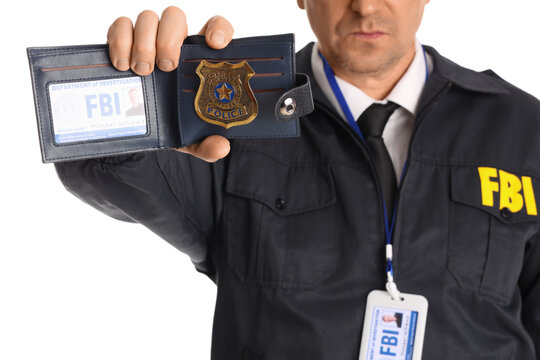 Mature FBI agent showing document on white background, closeup