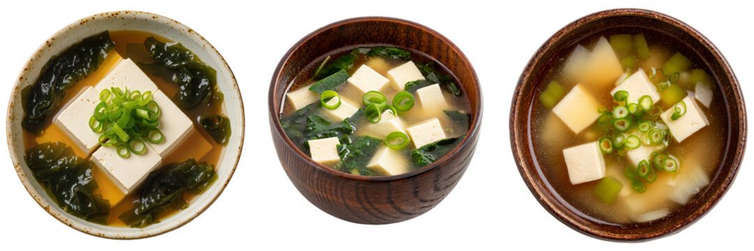 Three bowls of miso soup with tofu, seaweed, and green onions isolated on a white background