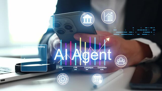 A man is using a smartphone while sitting at a desk. The screen shows data visuals related to AI and marketing metrics. The setting is an office with natural light.