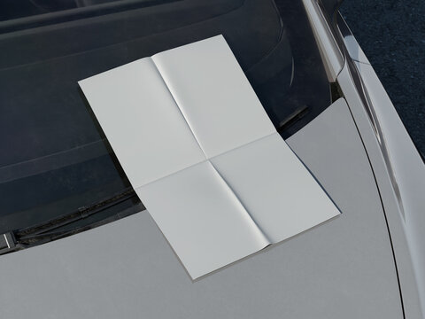 Blank white folded paper mockup on car hood outdoor