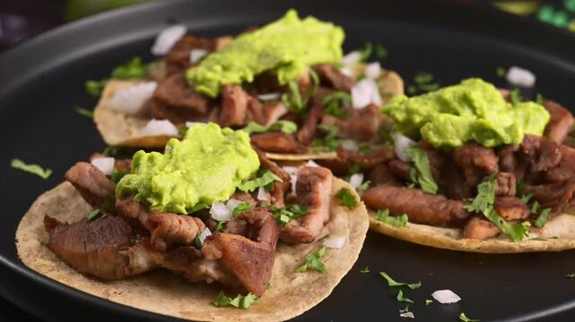 Mexican Street Food. Authentic Tacos de asada with creamy guacamole
