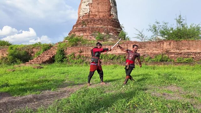 Thai Warriors Sparring with Swords at Ayutthaya Ancient Ruins