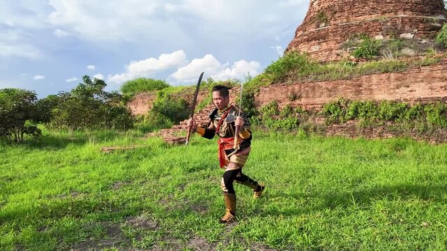 Thai Warrior Performing Traditional Sword Dance at Ayutthaya Historical Park