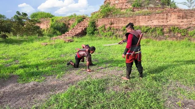 Thai Warriors Reenacting Ancient Combat at Ayutthaya Historical Ruins