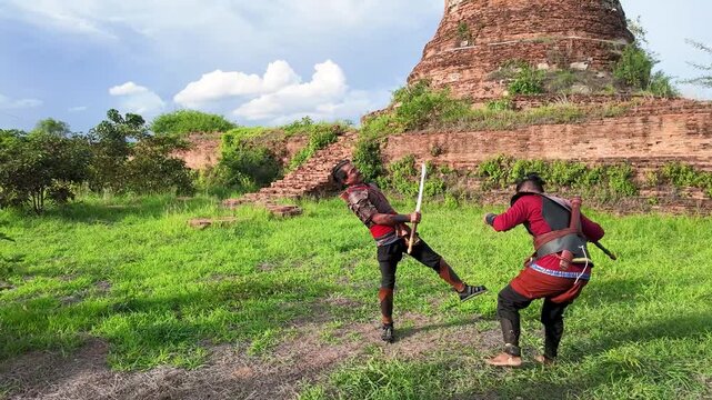Thai Warriors Sparring with Swords at Ayutthaya Ancient Ruins