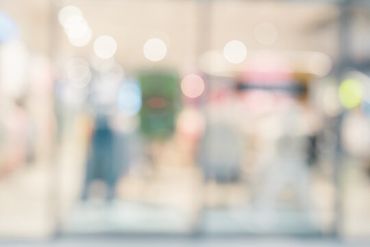 Blurred shopping mall background creating peaceful atmosphere with soft light, providing calm feeling for commercial backdrop use