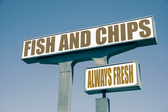 Old worn fish and chips sign