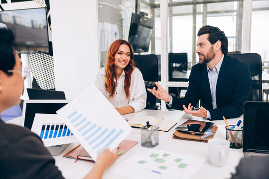 Diverse business professionals having a meeting discussing data