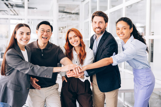 Diverse business team showing unity and collaboration in office