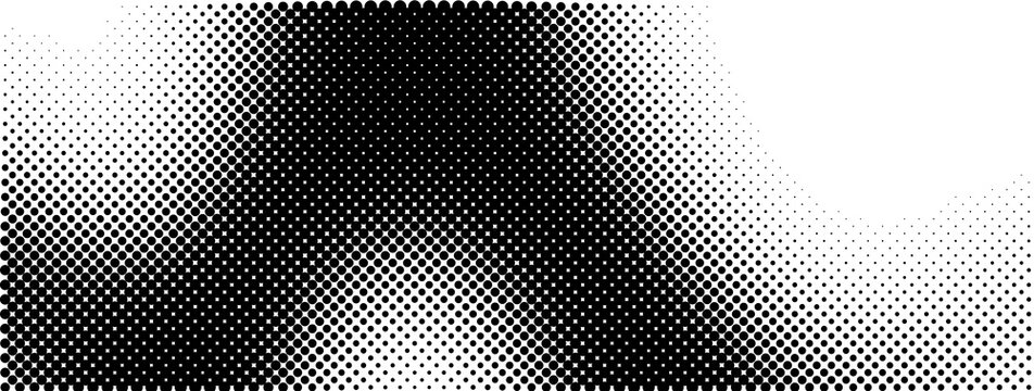 Abstract monochrome halftone dot pattern fading into white space