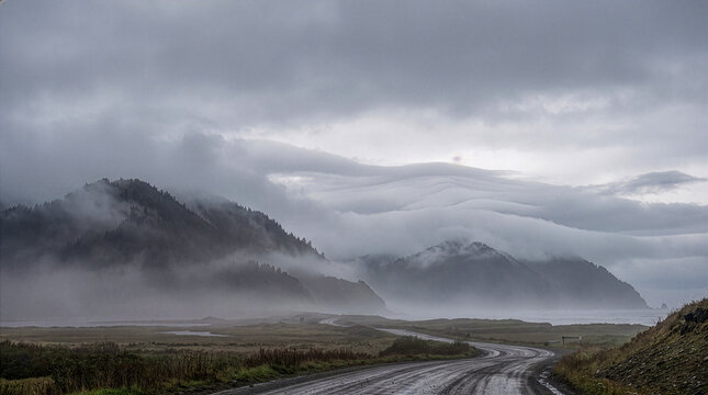 Foggy mountain landscape beneath stratocumulus clouds