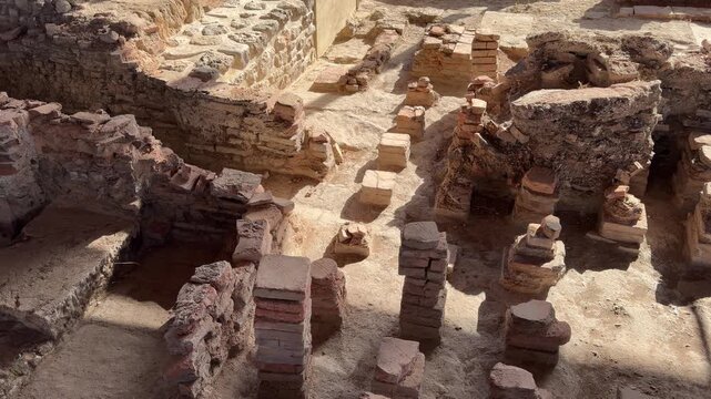 Ancient roman bath hypocaust ruins in archaeological site