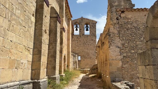 Walking through a narrow alley in ancient ruins