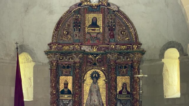 Ornate golden baroque altarpiece inside an ancient church