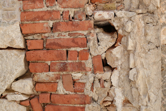 Weathered red brick and white stone wall background