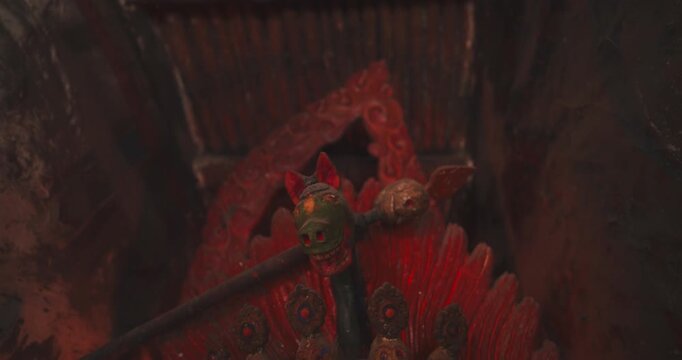 Annnapurna Circuit, Manang Nepal Camera shot pulling out from an ancient 9th-century clay and pigment Vajrapani sculpture in Bhraka Monastery enclosed inside a muddy structure