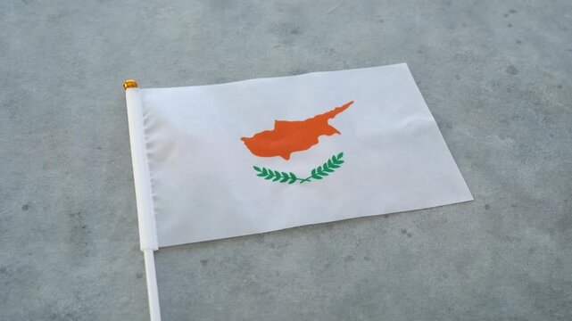 Cyprus country flag. Orbitating shot. Cypriot miniature flag close up.