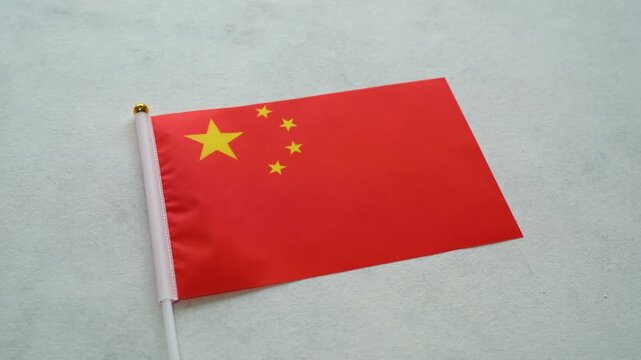 China flag close up on isolated background. Concept Chinese country flag.
