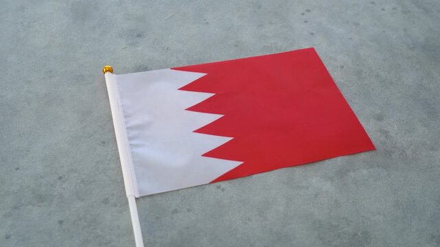 Bahrain flag close up on isolated background. Concept Bahraini country flag.