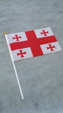 Georgia flag vertical close up shot. Concept Georgian country flag.