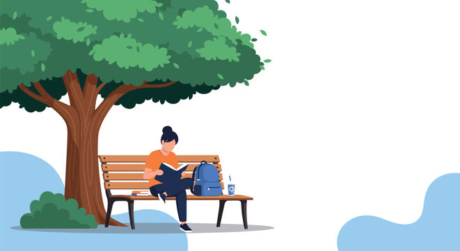 Young girl sits peacefully on a wooden park bench under a large leafy tree while focused on reading her favorite book.