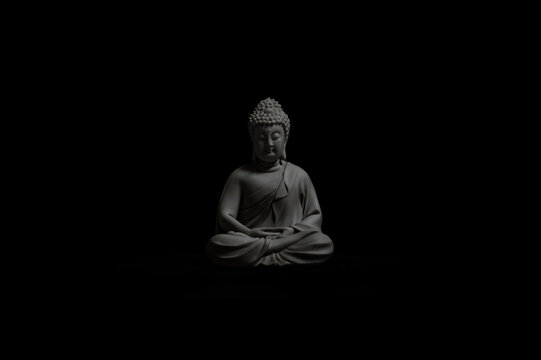 buddha statue isolated on black
Meditating Buddha statue illuminated against a dark background